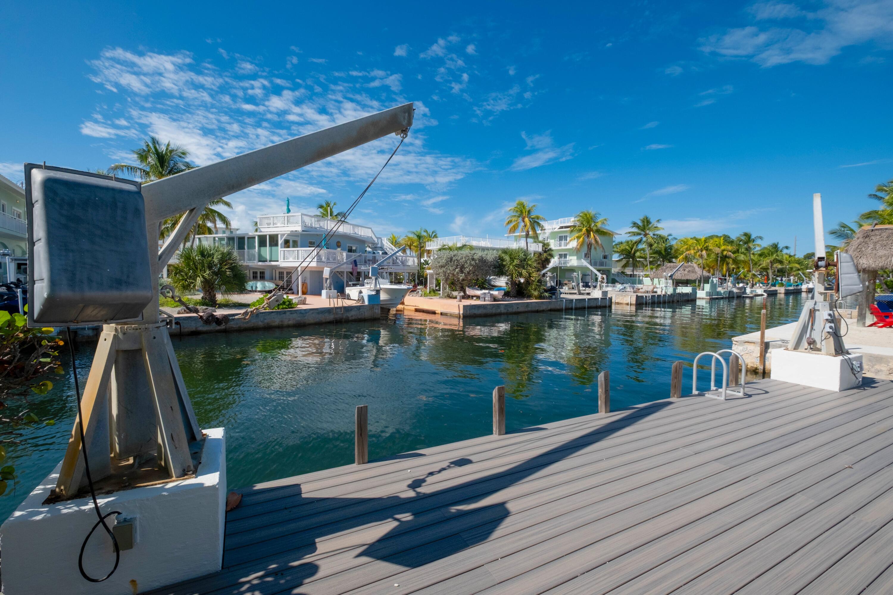 1202 Mockingbird Road Key Largo, FL 33037 - Photo 32 of 38 a view of a lake with houses