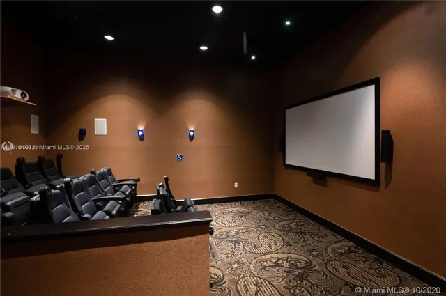 a front view of a house with garden and sitting area