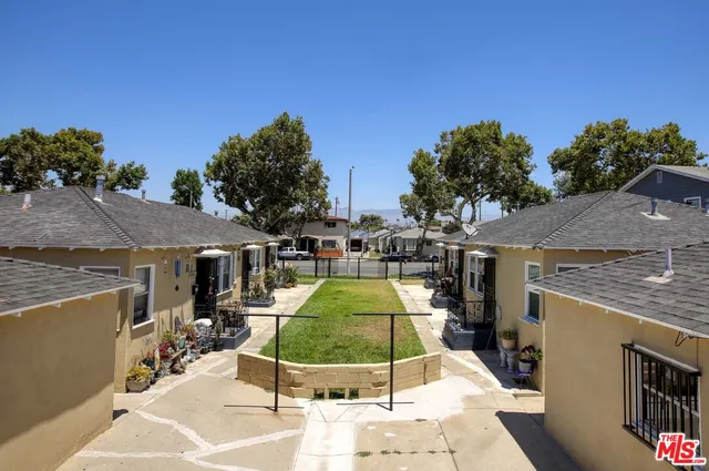 a swimming pool with outdoor seating and yard