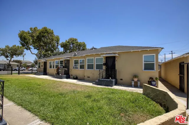 a front view of house with yard and seating area