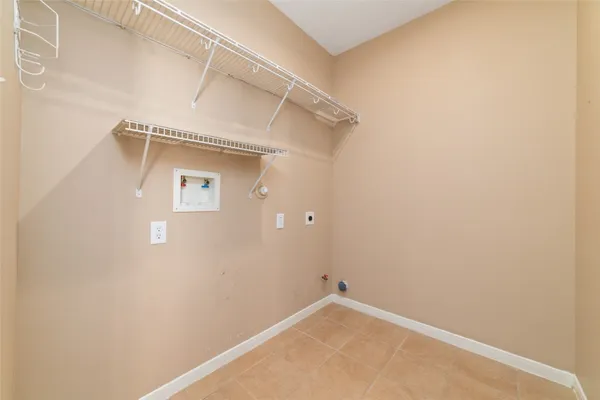 a bathroom with a toilet sink vanity and mirror