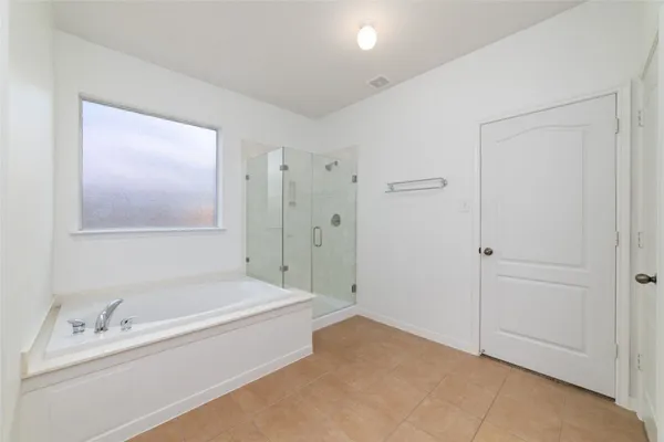 a spacious bathroom with a double vanity sink a mirror and a shower