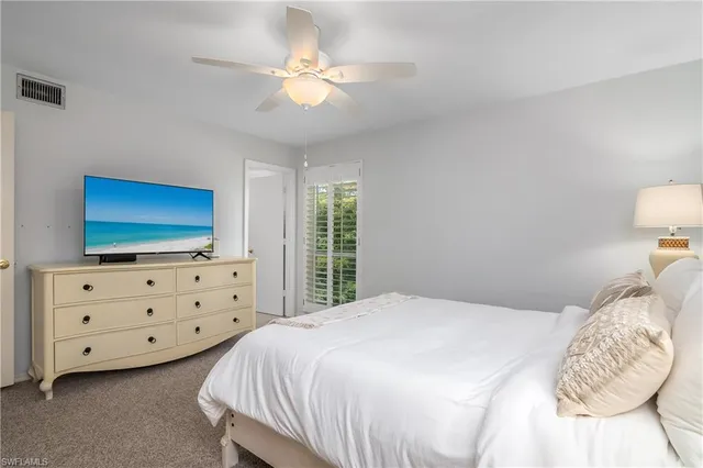 a bathroom with a toilet a sink and shower