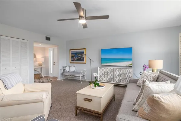 a living room with furniture and a couch