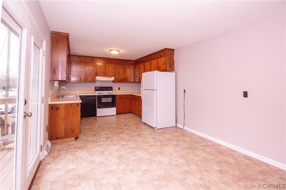 14619 Gatewood Road Dewitt, VA 23840 - Photo 4 of 14 a open kitchen with cabinets and refrigerator