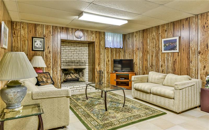 425 Thompson Run Road Pittsburgh, PA 15237 - Photo 15 of 24 Lower level game room is huge with another gas fireplace and ceramic tile.
