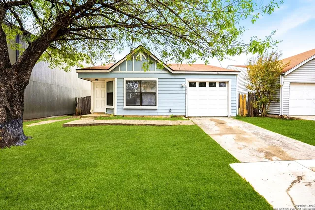 a front view of a house with yard