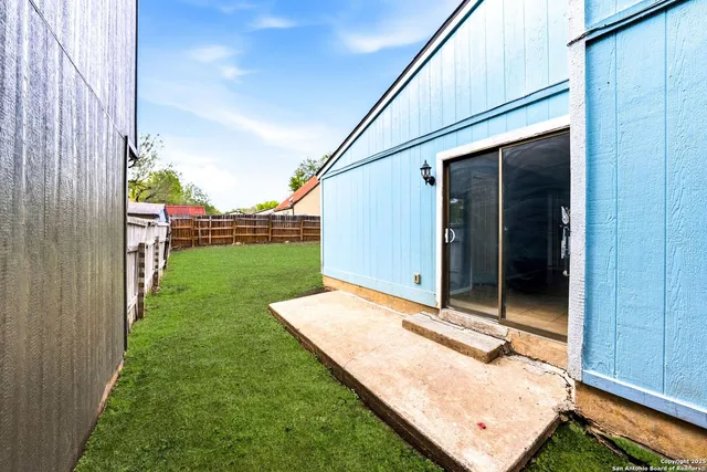 a backyard of a house with seating space