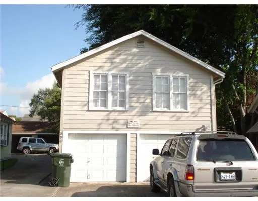 a front view of a house with garage