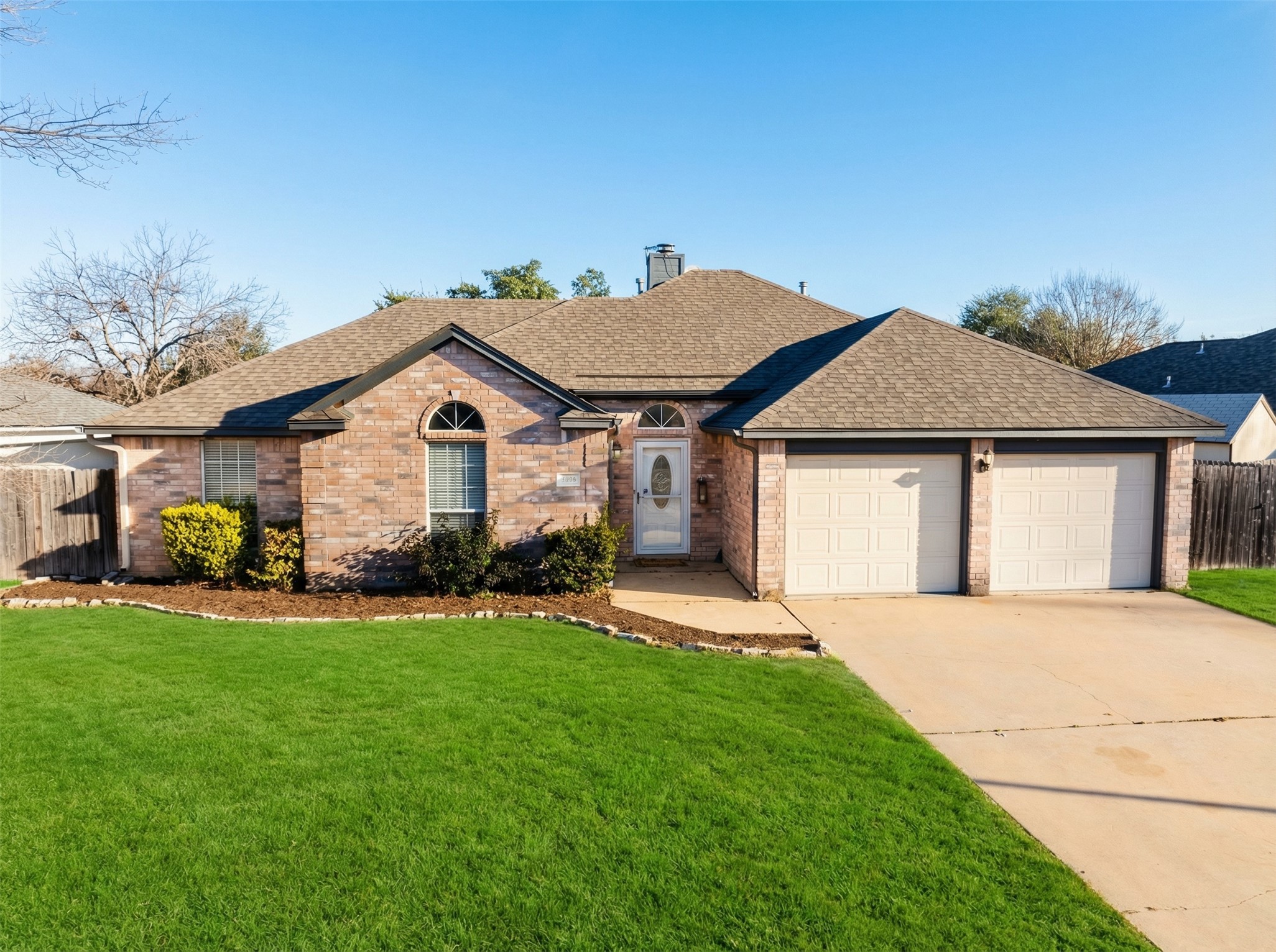 2204 Sycamore Trail Round Rock, TX 78664 - Photo 1 of 1 a front view of a house with a yard and garage