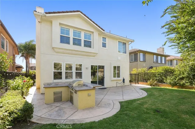 a view of a house with a yard porch and sitting area
