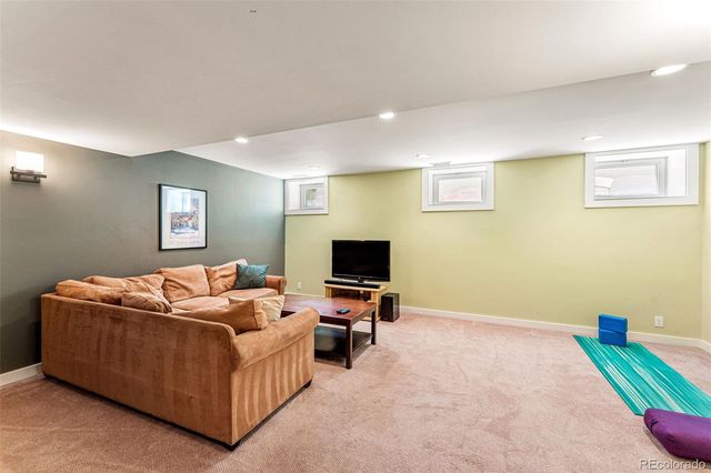 a bed room with bed and a flat screen tv