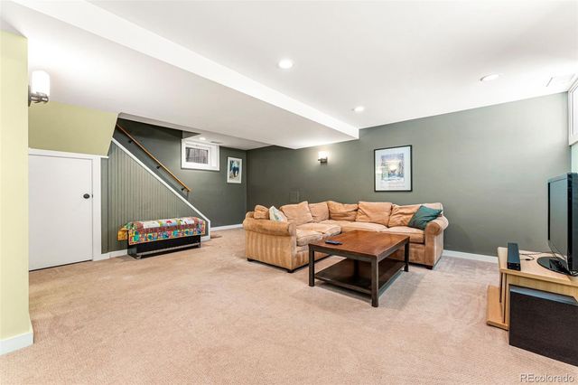 a spacious bedroom with a bed and a couch