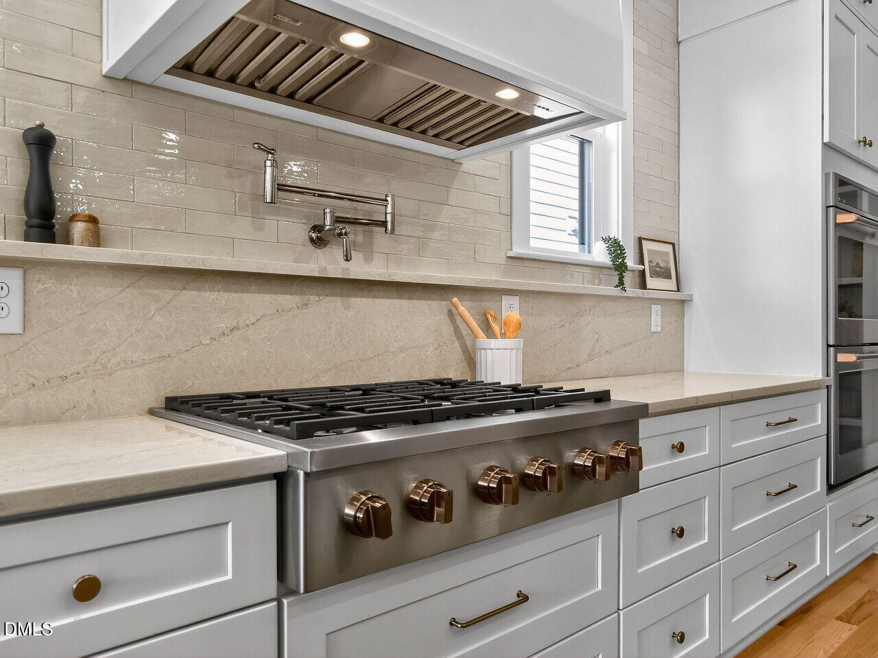 208 East Whitaker Mill Road Raleigh, NC 27608 - Photo 20 of 52 a stove top oven sitting inside of a kitchen