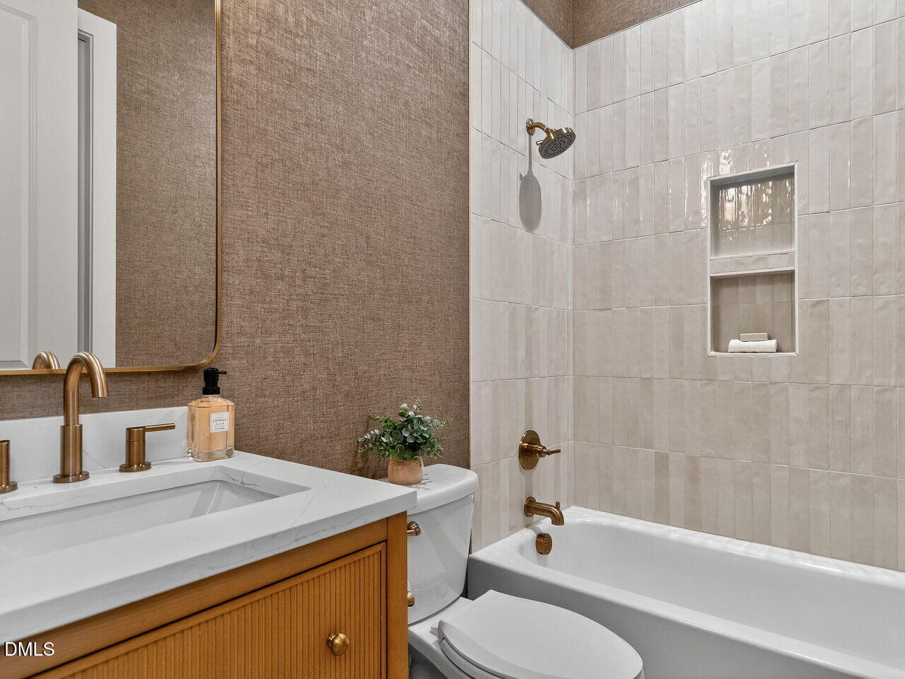 208 East Whitaker Mill Road Raleigh, NC 27608 - Photo 27 of 52 a bathroom with a sink toilet and shower