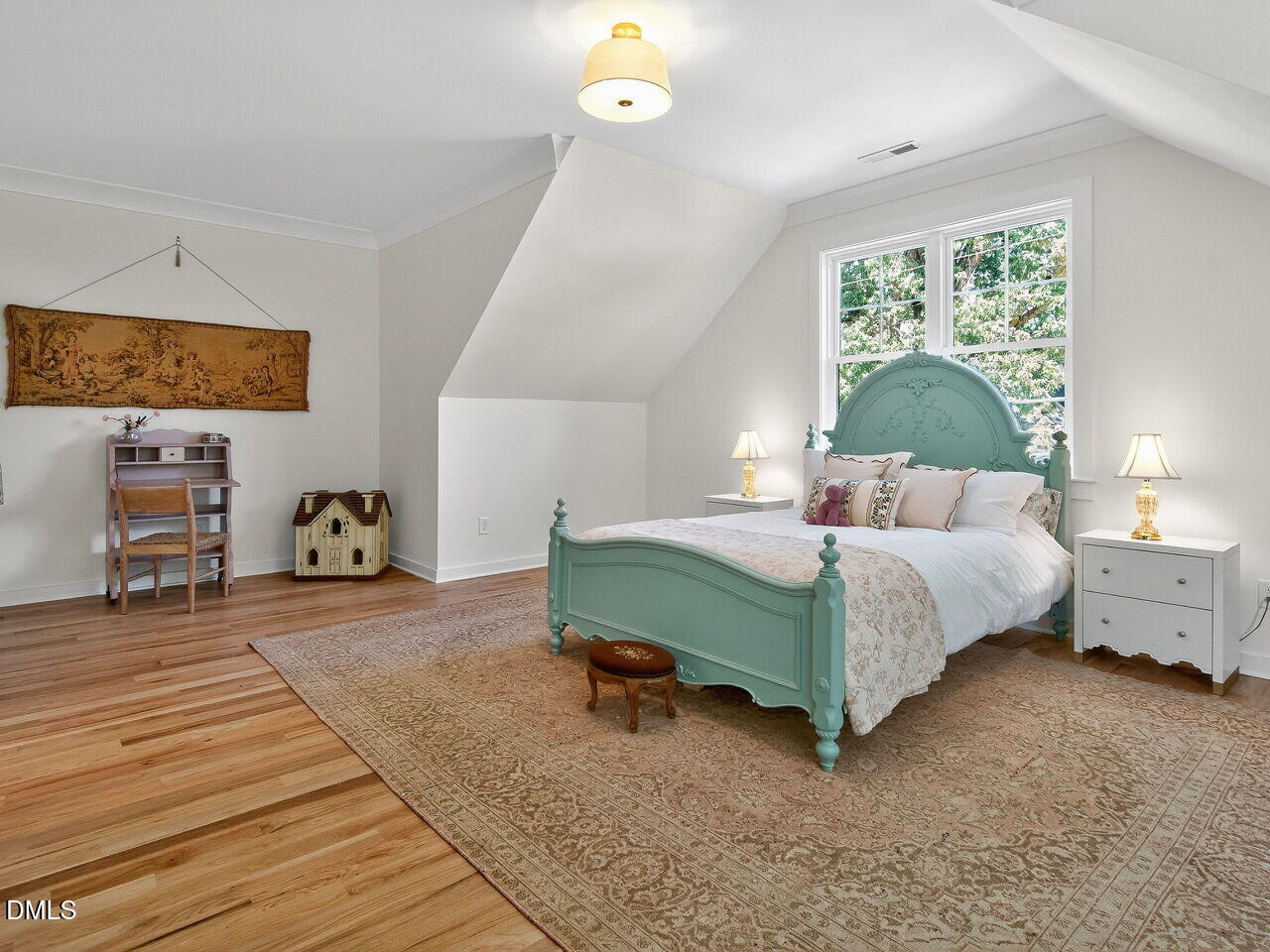 208 East Whitaker Mill Road Raleigh, NC 27608 - Photo 35 of 52 a bedroom with a bed and a window
