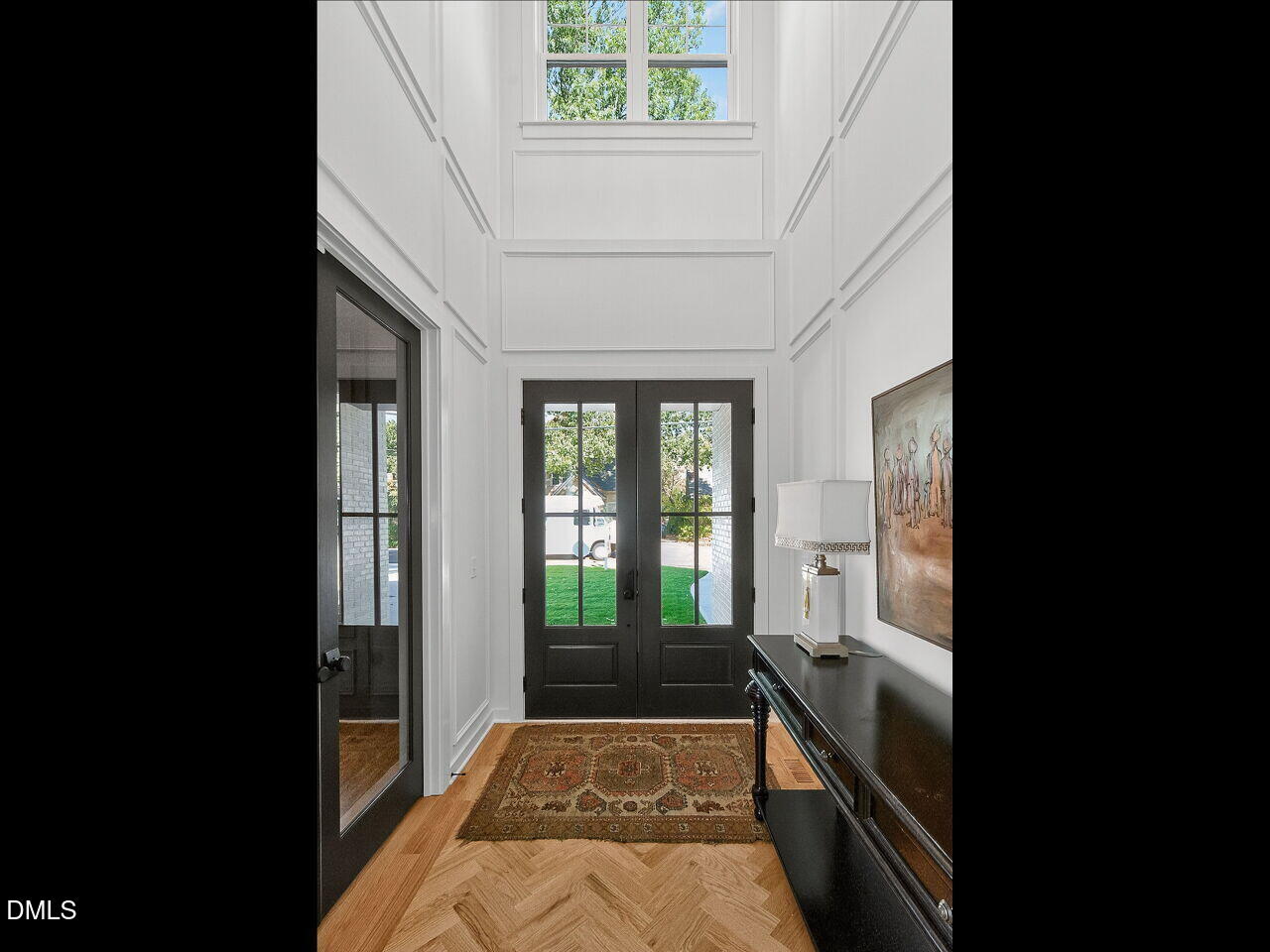 208 East Whitaker Mill Road Raleigh, NC 27608 - Photo 4 of 52 a view of a hallway to a livingroom with furniture