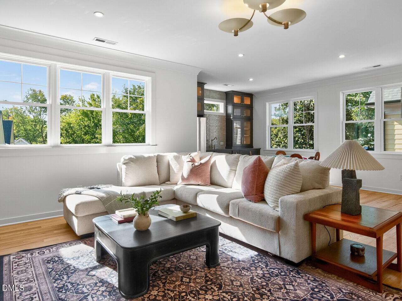 208 East Whitaker Mill Road Raleigh, NC 27608 - Photo 43 of 52 a living room with furniture and floor to ceiling windows