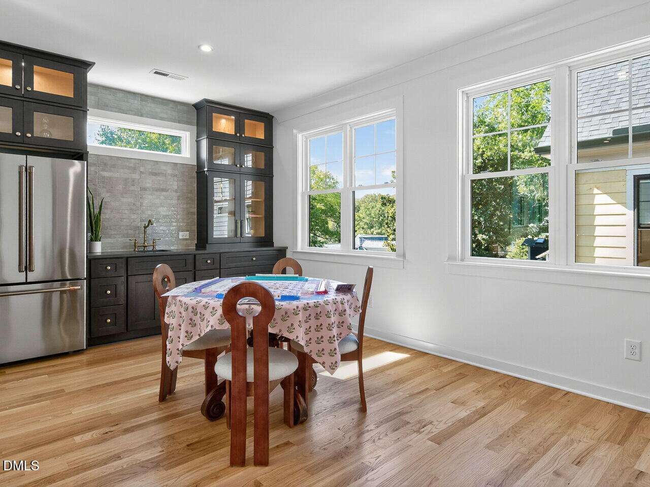 208 East Whitaker Mill Road Raleigh, NC 27608 - Photo 46 of 52 a view of a dining room with furniture window and wooden floor