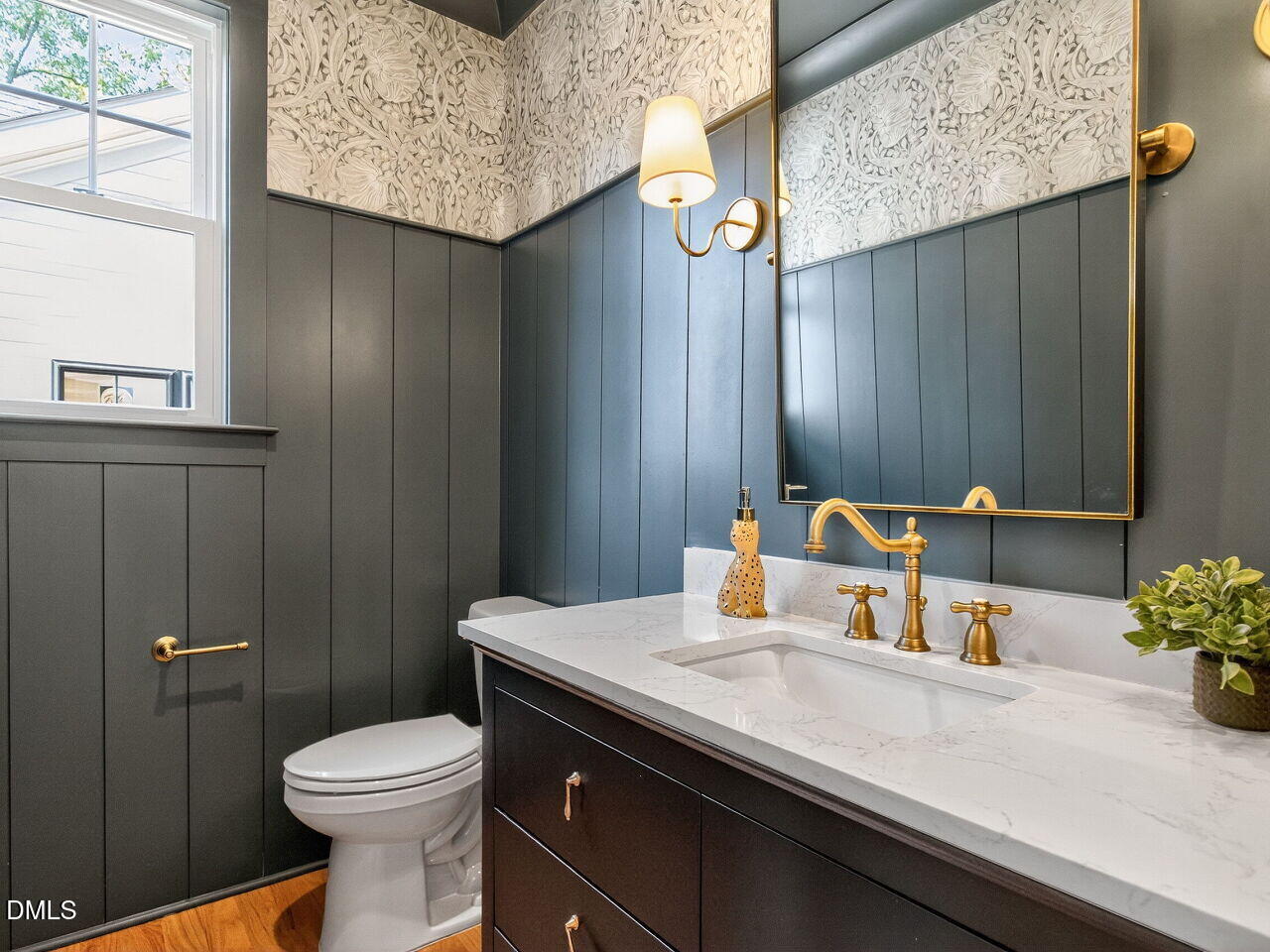 208 East Whitaker Mill Road Raleigh, NC 27608 - Photo 49 of 52 a bathroom with a sink a toilet and mirror
