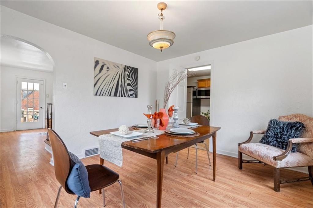 2318 Collins Road Pittsburgh, PA 15235 - Photo 12 of 36 a view of a dining room with furniture and wooden floor