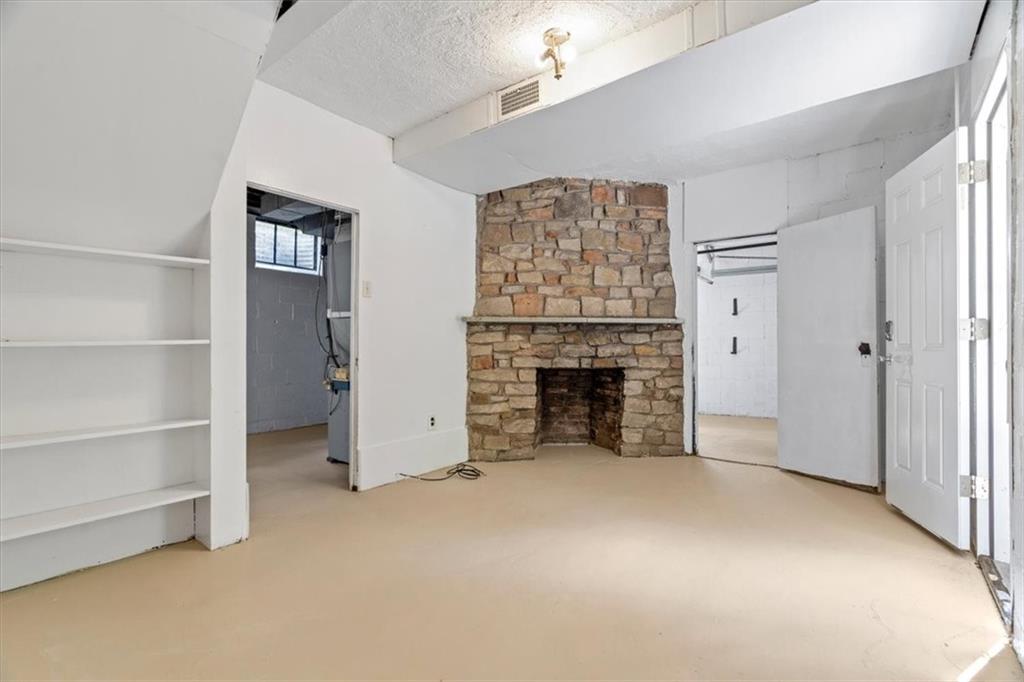 2318 Collins Road Pittsburgh, PA 15235 - Photo 24 of 36 a view of an empty room with a fireplace and a window