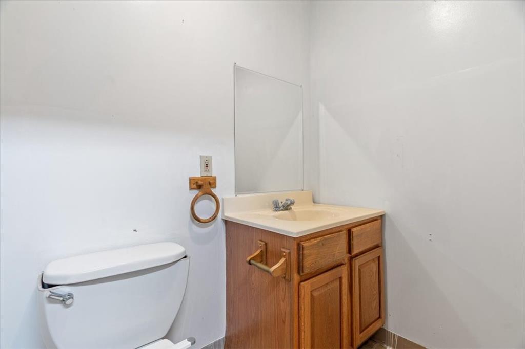 2318 Collins Road Pittsburgh, PA 15235 - Photo 25 of 36 a bathroom with a toilet a sink and mirror