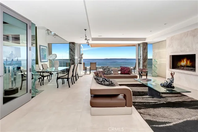 a room with lots of furniture and a painting on the wall