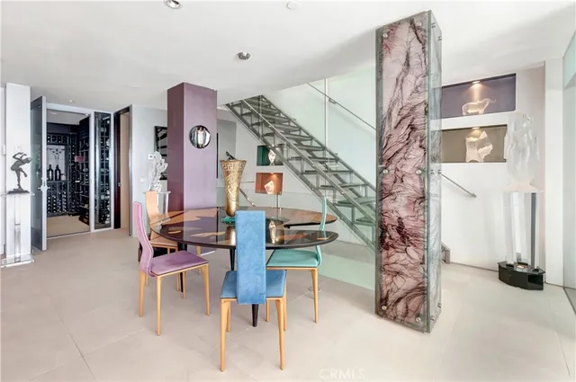a large white kitchen with a sink and cabinets