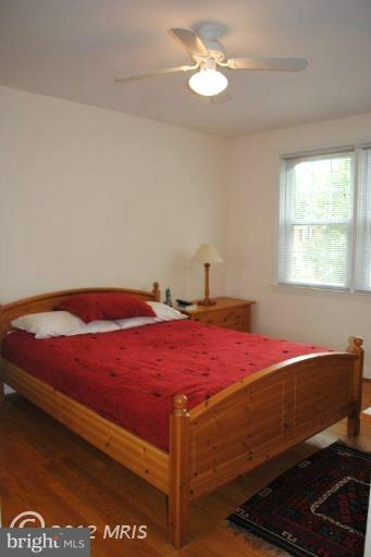 310 Stanmore Road Baltimore, MD 21212 - Photo 12 of 24 a bedroom with a bed and a window