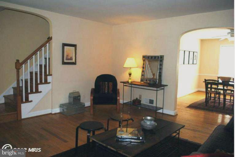 310 Stanmore Road Baltimore, MD 21212 - Photo 14 of 24 a living room with furniture and a dining table