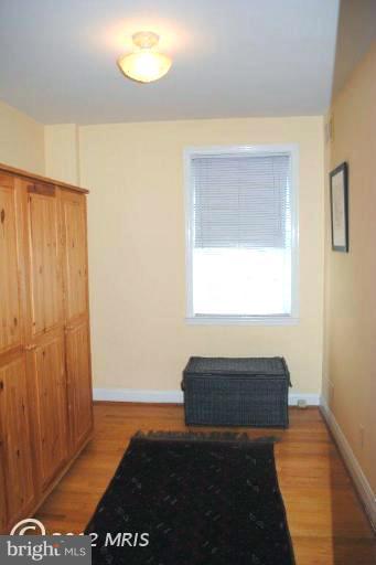 310 Stanmore Road Baltimore, MD 21212 - Photo 15 of 24 a living room with a bed furniture and next to a window