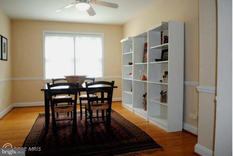 310 Stanmore Road Baltimore, MD 21212 - Photo 16 of 24 a view of a dining room with furniture and wooden floor