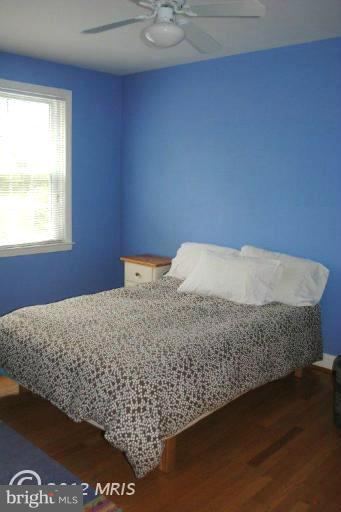 310 Stanmore Road Baltimore, MD 21212 - Photo 20 of 24 a bedroom with a bed and window