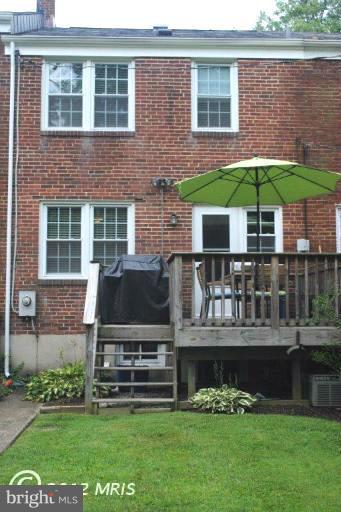 310 Stanmore Road Baltimore, MD 21212 - Photo 21 of 24 a front view of a house with a garden and lake view