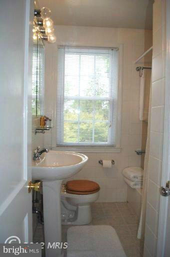 310 Stanmore Road Baltimore, MD 21212 - Photo 6 of 24 a bathroom with a sink toilet and shower
