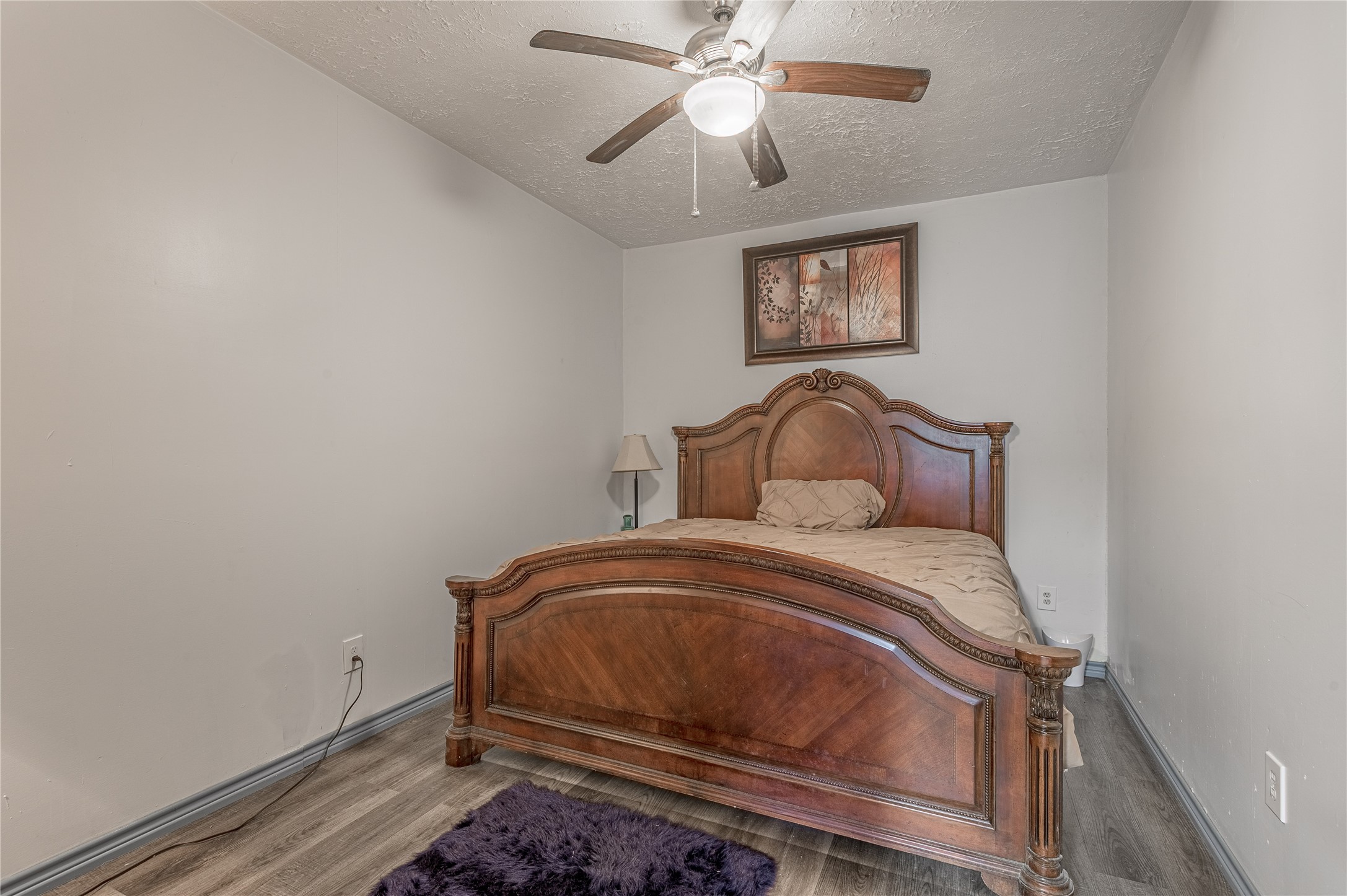 47-57 Stage Coach Road Coldspring, TX 77331 - Photo 39 of 50 a bedroom with a bed and a chandelier