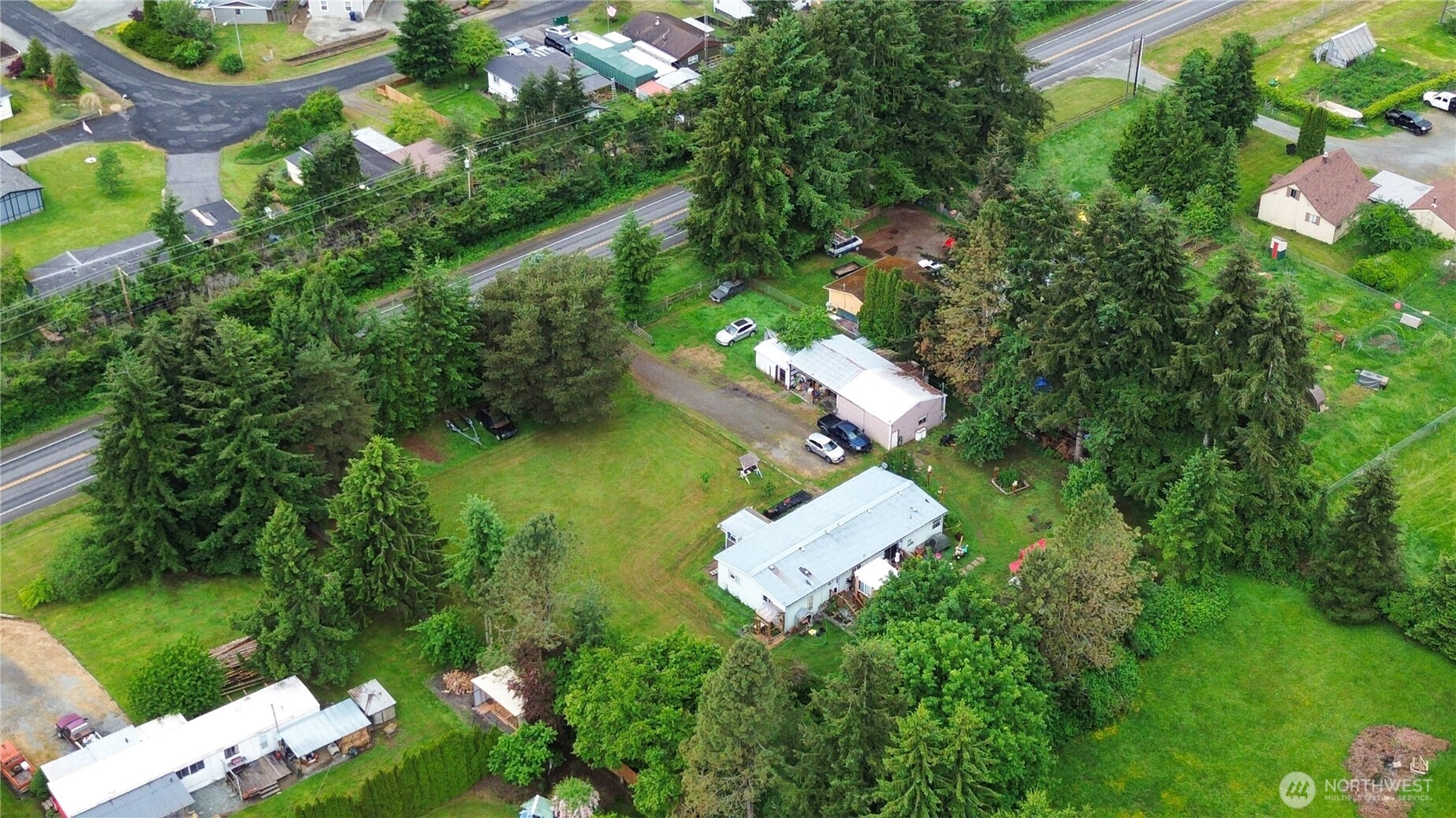 7185 Old Highway 99 North Road Burlington, WA 98233 - Photo 21 of 26 an aerial view of a house with a yard basket ball court and outdoor seating