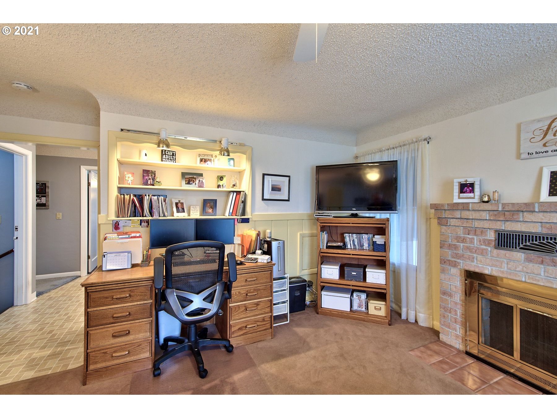 21451 River Road Northeast St. Paul, OR 97137 - Photo 13 of 32 a living room with furniture a flat screen tv and kitchen view