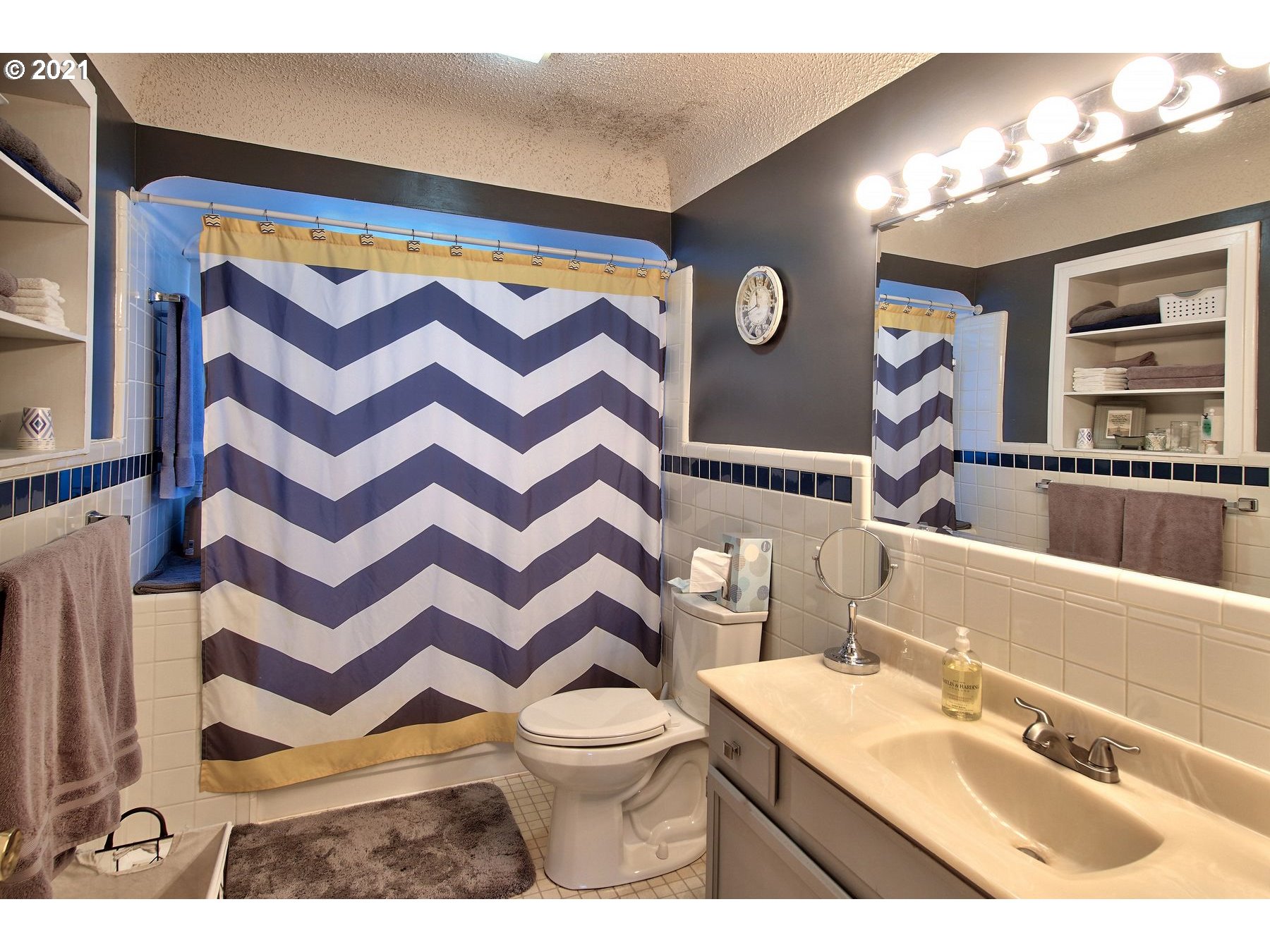 21451 River Road Northeast St. Paul, OR 97137 - Photo 18 of 32 a bathroom with a sink a toilet and a mirror
