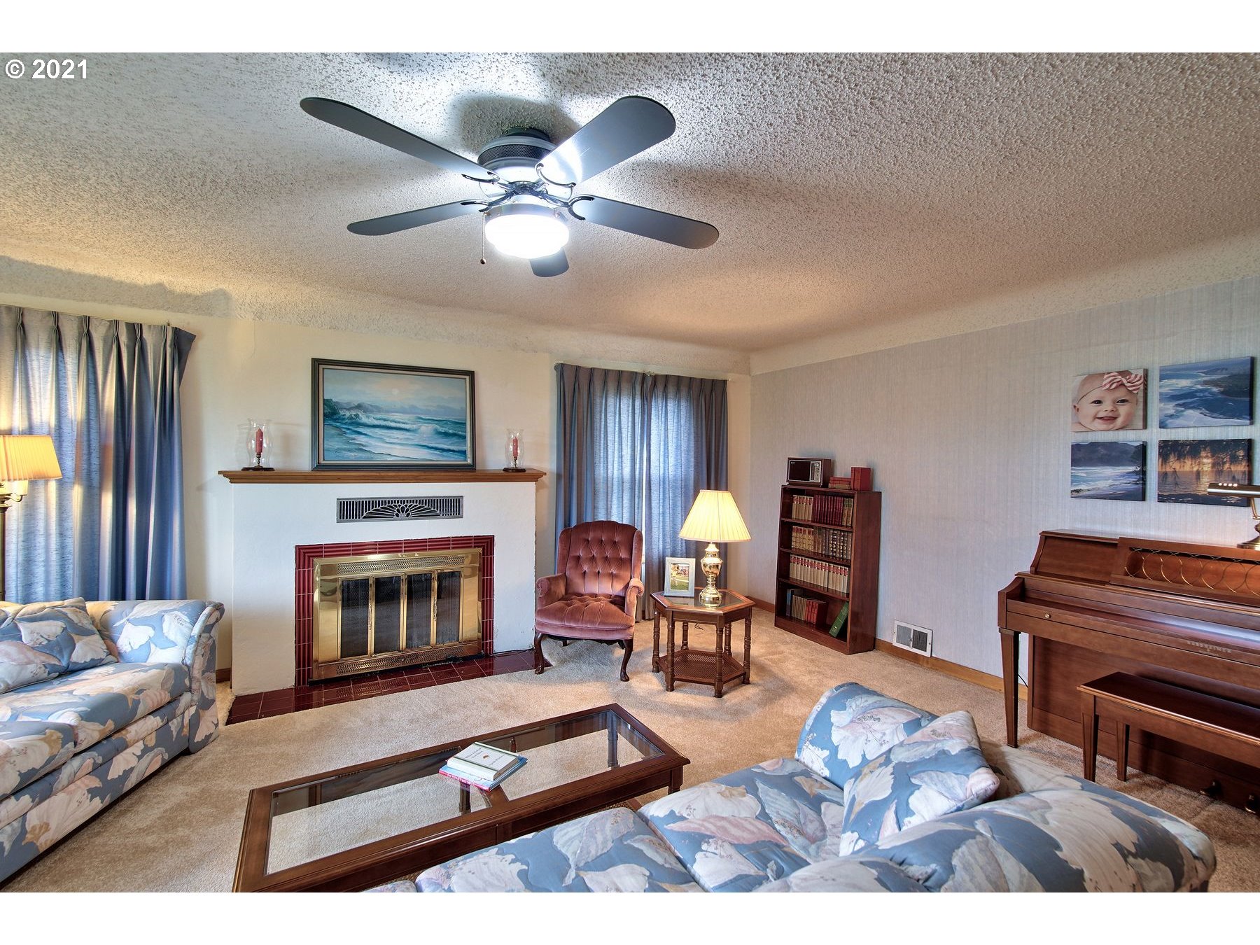 21451 River Road Northeast St. Paul, OR 97137 - Photo 5 of 32 a living room with furniture and a fireplace