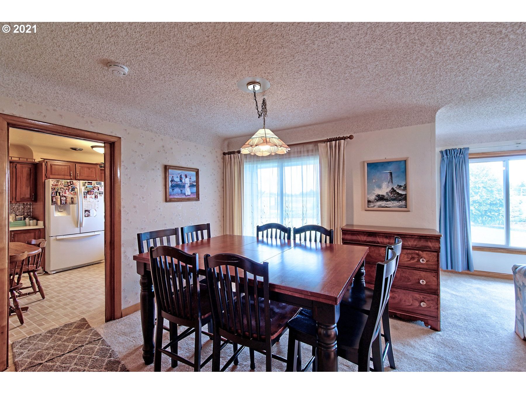 21451 River Road Northeast St. Paul, OR 97137 - Photo 8 of 32 a view of a dining room with furniture window and wooden floor