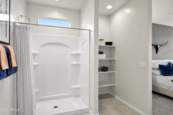 a bathroom with a shower and a tub