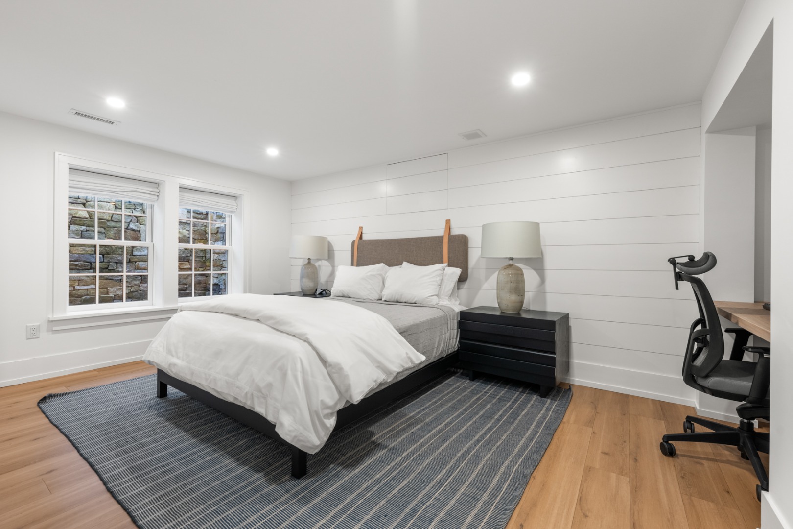 174 Cliff Road Nantucket, MA 02554 - Photo 33 of 49 a bedroom with a bed and wooden floor