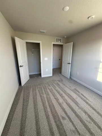 a view of a kitchen with a sink and cabinets