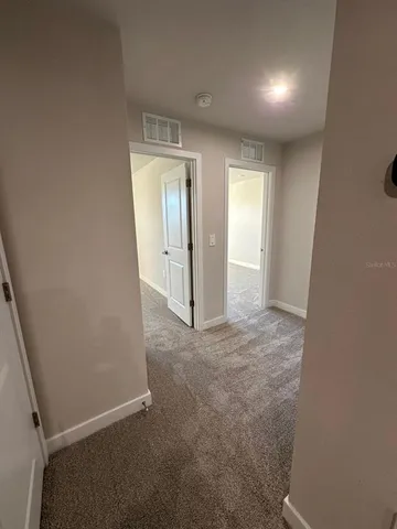 a bathroom with a glass door shower