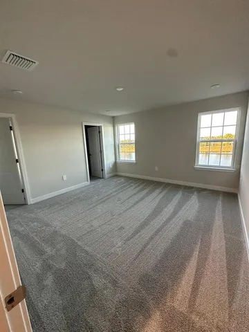 a bathroom with a glass door shower