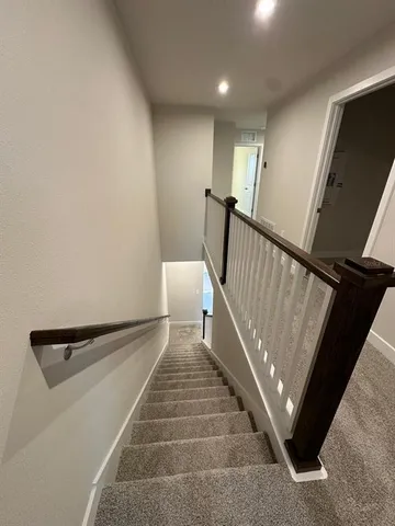 a view of a big room with closet and wooden floor