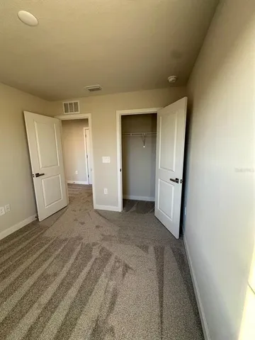 a view of storage and utility room with a sink