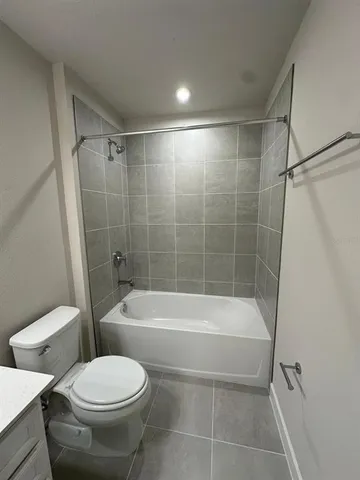 an empty room with staircase painted walls & windows